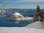 A view of Wizard Island covered in snow, taken near North Junction, at Crater Lake National Park in Oregon.