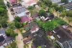 This aerial shot taken using a drone shows a flooded neighborhood in Medan, North Sumatra, Indonesia, Friday, Nov. 28, 2025. 