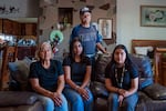 Teodoro Ramirez stands behind his wife, Margarita Ramirez, and their granddaughters, Yelena (center) and Evette Ramirez.