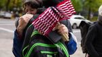 Maureen Valdez, left, from Beaverton and Dory Borck from Portland, both supporters of the occupation, embrace following the deliverance of a not guilty verdict for all defendants in the occuption of the Malheur National Wildlife Refuge.