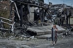 A woman at the scene of a building damaged after Russian missile strikes in Pokrovsk, Donetsk region, Ukraine, Aug. 9.