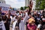A man sings a spirtual song during a voting rally, Saturday, May 16, 2026, in Montgomery, Ala.