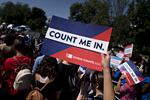 A demonstrator holds a sign that reads "Count Me In" outside the U.S. Supreme Court in 2019. Sen. Brian Schatz, D-Hawaii, has introduced companion legislation to a House bill that could help prevent political interference with future head counts.