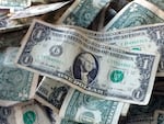 FILE - This Oct. 24, 2016 file photo shows dollar bills in New York.