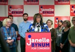 Janelle Bynum, center, gives an acceptance speech at her campaign headquarters in Clackamas, Ore., after winning the race to represent Oregon's Fifth Congressional District, Nov. 8, 2024.