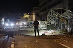 A crane sits on the street after crashing down into the building housing the Tampa Bay Times offices after the arrival of Hurricane Milton in St. Petersburg, Florida. Milton, which comes just after the recent catastrophic Hurricane Helene, landed into Florida's Gulf Coast late Wednesday evening as a Category 3 storm causing extensive flooding and damage.