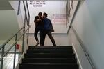 A couple walks upstairs from the citizenship ceremony to register to vote. Fifty-two people became United States citizens in an afternoon ceremony at the United States Citizenship and Immigration Services Field Office in Portland, Ore., on Wednesday, March 4, 2020.