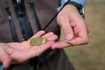 Fisherman James Adkins prepares a spinner to catch steelhead along the Clackamas River on July 22 2026.