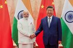 In this photo provided by Indian Prime Minister's Office, Indian Prime Minister Narendra Modi, left, and Chinese President Xi Jinping shake hands before their meeting on the sidelines of the Shanghai Cooperation Organization (SCO) summit in Tianjin, China Sunday, Aug. 31, 2025.
