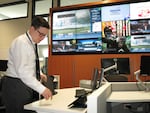 Dan Douthit of the Portland Bureau of Emergency Management starts up the computer at their emergency center in Southeast Portland.