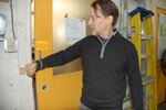 Coronavirus adaptation: Indow CEO Sam Pardue demonstrates how to pull the factory door open with an elbow. "We don’t want people using doorknobs anymore at all," he said.