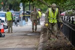National Guard members weed an area as they clean up a park near in Washington, DC, on September 18.