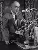 A.C. Glibert poses with his most lucratively successful invention, the erector set. 