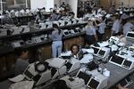 Workers prepare electronic voting machines during a sealing operation before Brazilian presidential elections in Brasília on Sept. 21.