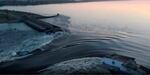 In a photo taken from video released by the Ukrainian Presidential Office, water surges through a break in the Kakhovka dam in southern Ukraine. Ukraine and Russia are both accusing each other of blowing up the dam, which also destroyed an attached hydroelectric power station.