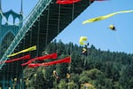 Kayaktavists and climbers rapelled from the St. Johns Bridge to block the Fennica, Shell's icebreaker ship, from leaving the port of Portland Wednesday, July 29, 2015.