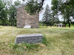 A century-old marker sits in front of the historic Stone Warehouse, which played a critical role in the U.S.-Dakota wars. The Lower Sioux Indian Community is putting up new markers to tell that story and many others on land the tribe now manages.