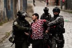 Police officers detain a demonstrator during an anti-government protest in La Paz, Bolivia, Monday, May 18, 2026.