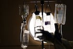 FILE - A nurse checks a patient's IV fluids at Providence Holy Cross Medical Center in Los Angeles in 2021. A North Carolina manufacturing plant that makes 60 percent of IV solutions in the U.S. was knocked offline by Hurricane Helene. Oregon hospitals are beginning to take measures to conserve supply.