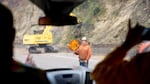 Crews work to remove fallen trees on I-84 East because of the Eagle Creek Fire on Sept. 14, 2017