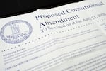 A paper shows some of the text on a proposed amendment to the Virginia state constitution.