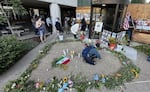On the evening of July 10, 2026, people laid out flowers and candles in honor of Lorenzo Salgado Araujo, a man killed while being detained by ICE agents in Texas earlier in the week.
