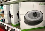 Roomba robot vacuums made by iRobot are displayed on a shelf at a Target store in California.