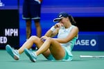 Iga Swiatek of Poland reacts after defeating Ons Jabeur of Tunisia to win the women's singles final of the U.S. Open tennis championships on Saturday.