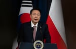 South Korean President Yoon Suk Yeol speaks during a joint press conference with Poland's President Andrzej Duda (not seen in the photo) at the Presidential Office in Seoul, South Korea, Thursday.