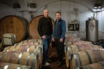 Golan Heights Winery CEO Assaf Ben Dov (left) and head winemaker Victor Schoenfeld are photographed in one of the winery's cellars in Katzrin, the Golan Heights, on Jan. 8, 2024.