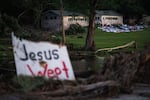 Campers belongings sit outside one of Camp Mystic's cabins near the Guadalupe River, July 7, 2025, in Hunt, Texas, after a flash flood swept through the area.