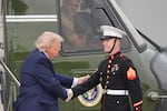 President Donald Trump shakes hands with a member of the U.S. Marine Corps as he arrives on Marine One to board Air Force One at Morristown Airport, Friday, May 22, 2026, in Morristown, N.J.