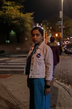 Prita Rozario, 30, a Hells Kitchen resident that is volunteering to help inform Jackson Heights voters of proposals on their ballot, stands for a portrait.