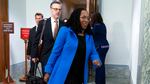 Supreme Court nominee Ketanji Brown Jackson, wearing a royal blue jacket, arrives for the third day of her confirmation hearings.