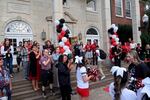 Staff members stand at the entrance of North Salem High School on Tuesday, Sept. 3, 2024, during a red-carpet event to welcome ninth graders.