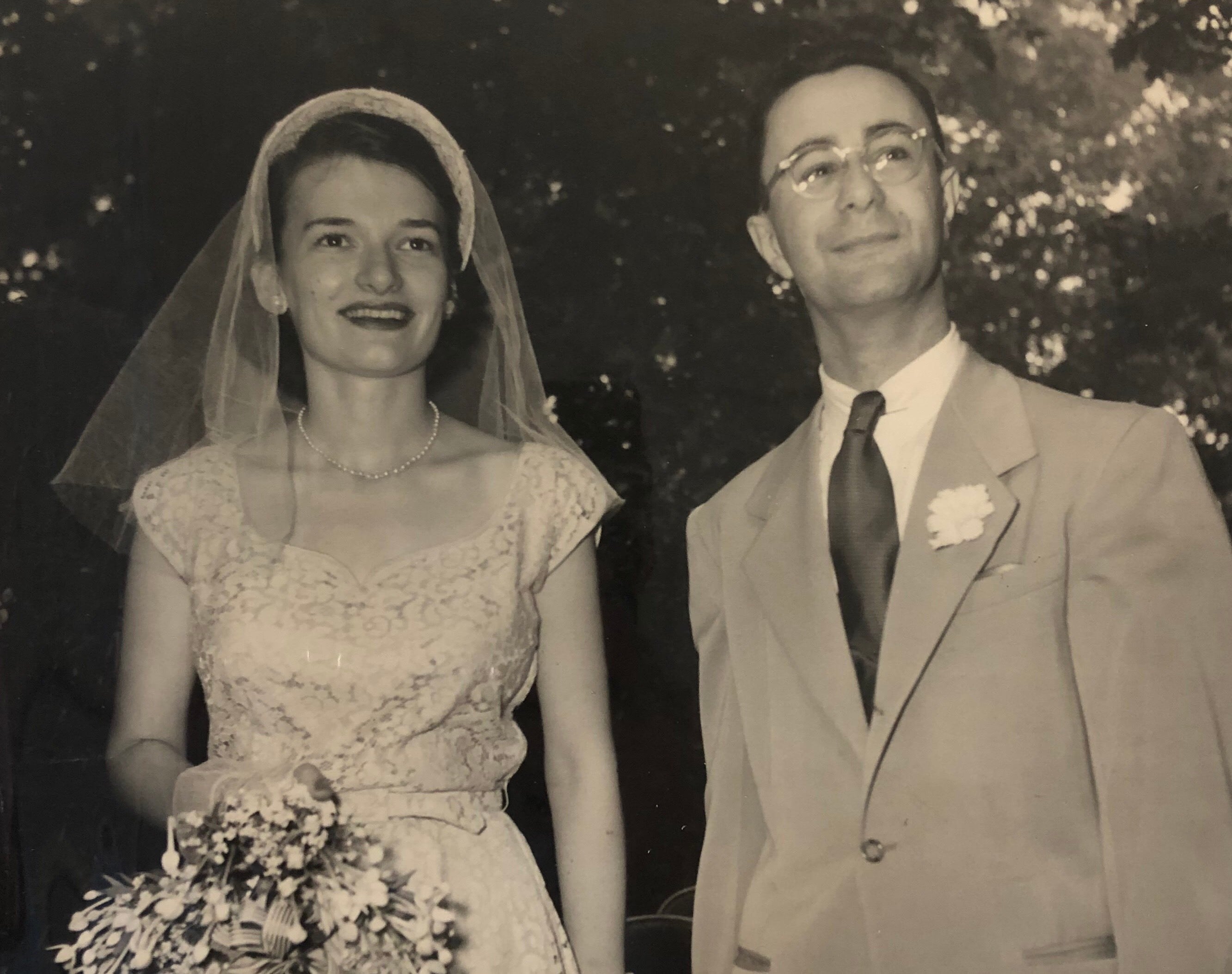 Elisabeth Simons stands with her husband, Harold Simons, at their wedding.
