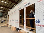 Oregon Gov. Tina Kotek examines a mass timber affordable housing prototype.