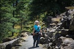 Photographer Linda Steider looks for pikas at Little Beacon Rock in the Columbia River Gorge. June 16, 2026