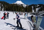 Hock Hockersmith, center, skis towards the ski lift. 