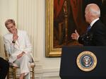 President Biden acknowledges U.S. soccer player Megan Rapinoe before presenting her with the Presidential Medal of Freedom.