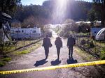FBI officials walk towards the crime scene at Mountain Mushroom Farm, Tuesday, Jan. 24, 2023, after a gunman killed several people at two agricultural businesses in Half Moon Bay, Calif.