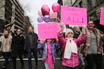 Young girls carry signs through the streets of Portland during the Women's March Saturday, Jan. 21, 2017.