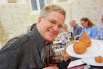 Rick eating arancini (stuffed rice balls) in Sicily