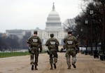 National Guard patrol along the National Mall in front of the Capitol, Wednesday, Nov. 26, 2025, in Washington.