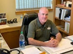 Josephine County Sheriff Dave Daniel sits at his desk.