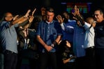 Brazilian President Jair Bolsonaro receives a blessing during a music festival organized by a local evangelic radio station on July 2, in Rio de Janeiro.