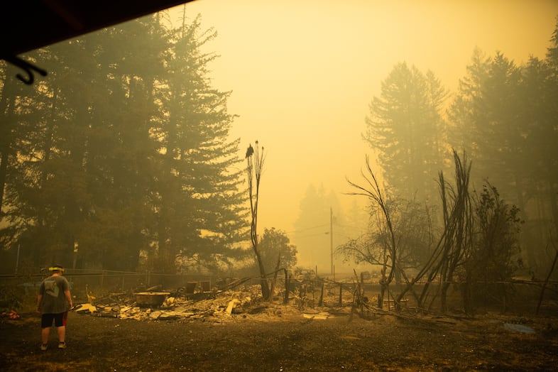 The charred remains of the Emersons' backyard destroyed in the Santiam Fire near Gates, Ore., Sept. 9, 2020.