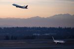 A plane takes off on Monday, December 11, 2017, at Seattle-Tacoma International Airport.