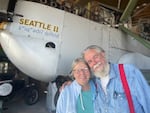 Bob and Diane Dempster with the replica World Cruiser <em>Seattle II</em>, which they intend to donate to Seattle’s Museum of Flight.