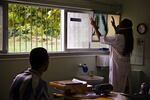 A physician in Rio de Janeiro, Brazil, examines an x-ray of a tuberculous patient.